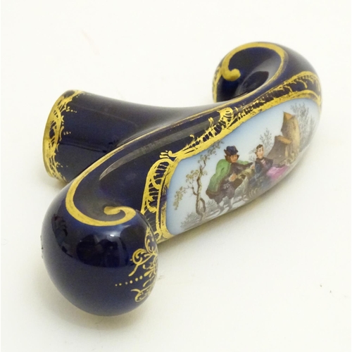 77 - A Continental ceramic cane handle with a cobalt blue ground and hand painted winter scene depicting ... 