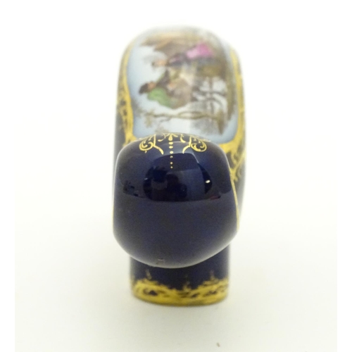 77 - A Continental ceramic cane handle with a cobalt blue ground and hand painted winter scene depicting ... 