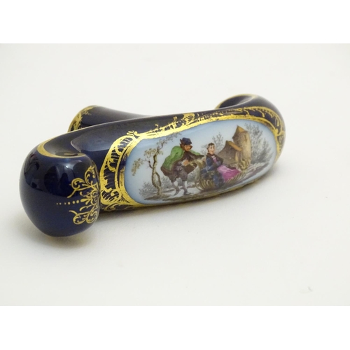 77 - A Continental ceramic cane handle with a cobalt blue ground and hand painted winter scene depicting ... 