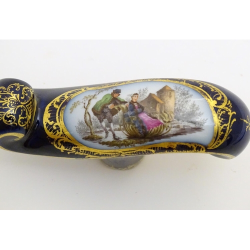 77 - A Continental ceramic cane handle with a cobalt blue ground and hand painted winter scene depicting ... 