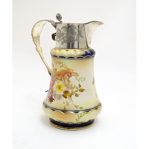 78 - A Wiltshaw & Robinson Carlton Ware jug with floral decoration, with silver plate mounts and handle. ... 