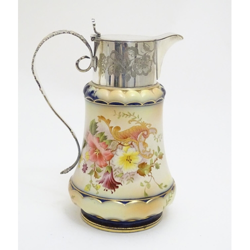 78 - A Wiltshaw & Robinson Carlton Ware jug with floral decoration, with silver plate mounts and handle. ... 