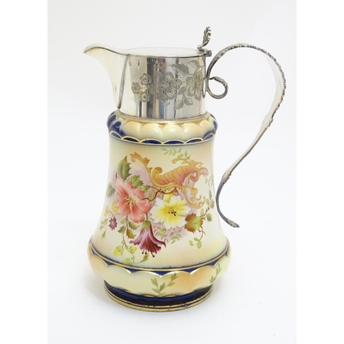 78 - A Wiltshaw & Robinson Carlton Ware jug with floral decoration, with silver plate mounts and handle. ... 