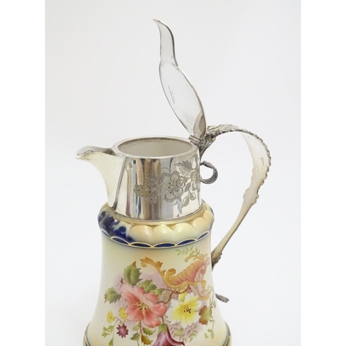 78 - A Wiltshaw & Robinson Carlton Ware jug with floral decoration, with silver plate mounts and handle. ... 