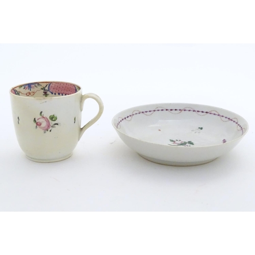 79 - A New Hall tea cup with hand painted floral decoration. Together with a saucer with hand painted flo... 