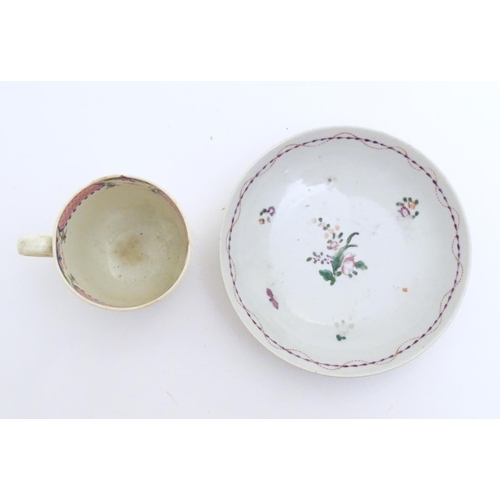 79 - A New Hall tea cup with hand painted floral decoration. Together with a saucer with hand painted flo... 