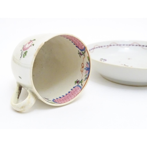 79 - A New Hall tea cup with hand painted floral decoration. Together with a saucer with hand painted flo... 