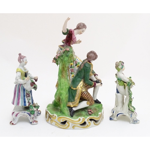 84 - A Derby porcelain figural group with two figures, a kneeling gentleman fitting a slipper on a young ... 