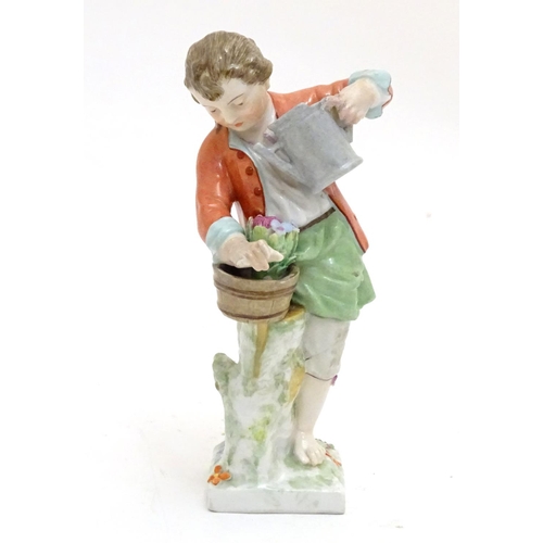 86 - A Continental porcelain figure modelled as a boy with a watering can tending to a pot of flowers. Ma... 