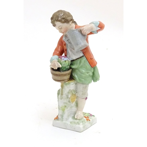 86 - A Continental porcelain figure modelled as a boy with a watering can tending to a pot of flowers. Ma... 