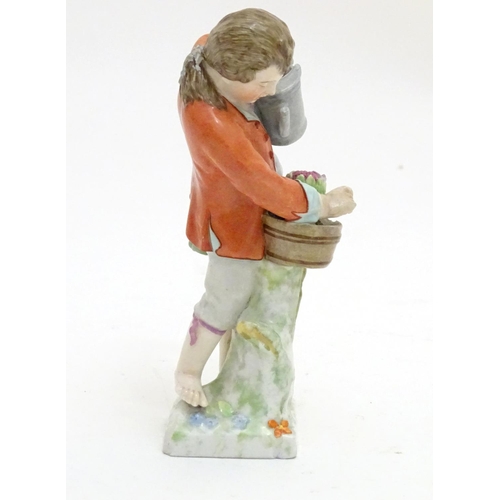 86 - A Continental porcelain figure modelled as a boy with a watering can tending to a pot of flowers. Ma... 