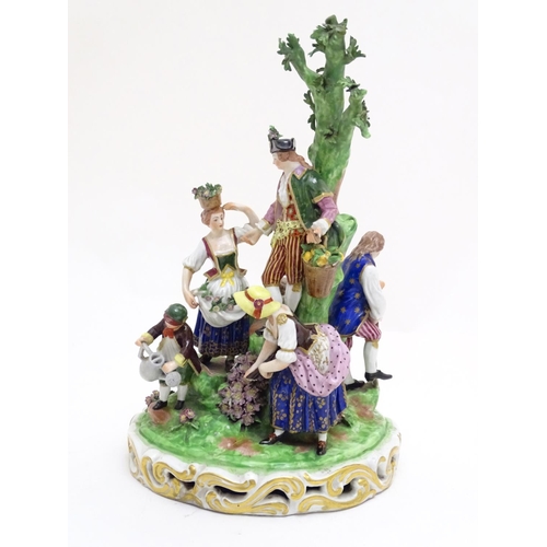 87 - A large Derby porcelain figural group garden scene, depicting men, women and children tending to and... 