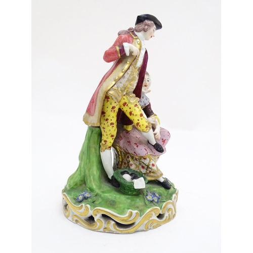 88 - A large Derby porcelain figural group depicting a young couple on a naturalistic base with flowers. ... 