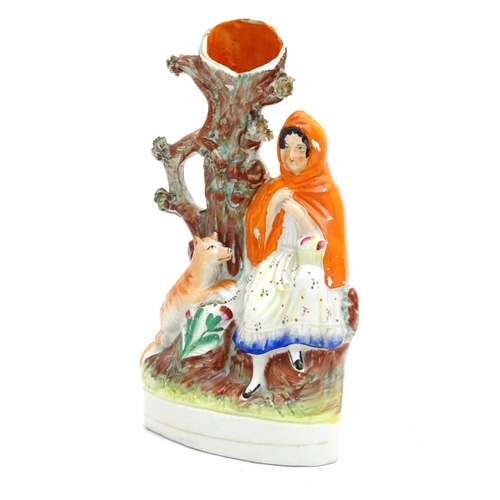 90 - A Staffordshire flatback bud vase depicting Little Red Riding Hood in a woodland scene with a wolf. ... 