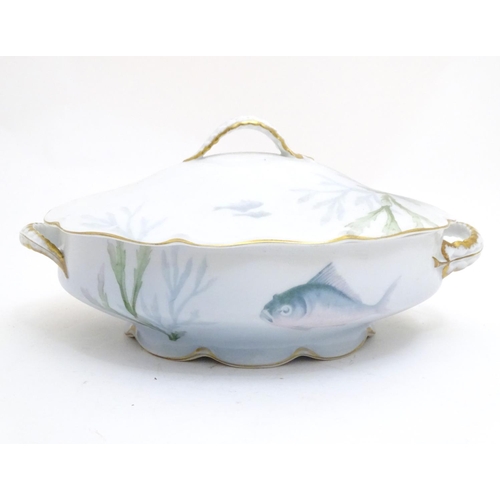 92 - A late 19thC Rosenthal oval scallop shaped tureen with a lobed gilt edged rim, decorated with underw... 