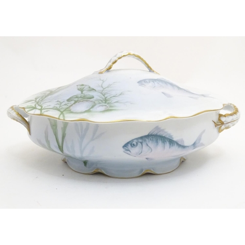 92 - A late 19thC Rosenthal oval scallop shaped tureen with a lobed gilt edged rim, decorated with underw... 