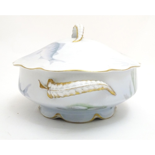 92 - A late 19thC Rosenthal oval scallop shaped tureen with a lobed gilt edged rim, decorated with underw... 