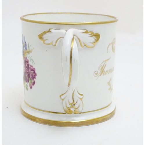 93 - A 19thC loving cup with hand painted floral display to one side and gilt inscription 'Thomas Blackwe... 