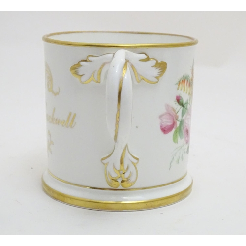 93 - A 19thC loving cup with hand painted floral display to one side and gilt inscription 'Thomas Blackwe... 