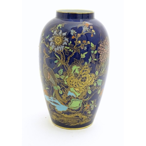 97 - A Wiltshaw and Robinson Carlton Ware baluster vase decorated in the pattern Rockery and Pheasant, wi... 