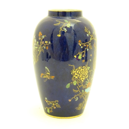 97 - A Wiltshaw and Robinson Carlton Ware baluster vase decorated in the pattern Rockery and Pheasant, wi... 