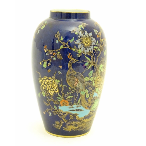 97 - A Wiltshaw and Robinson Carlton Ware baluster vase decorated in the pattern Rockery and Pheasant, wi... 