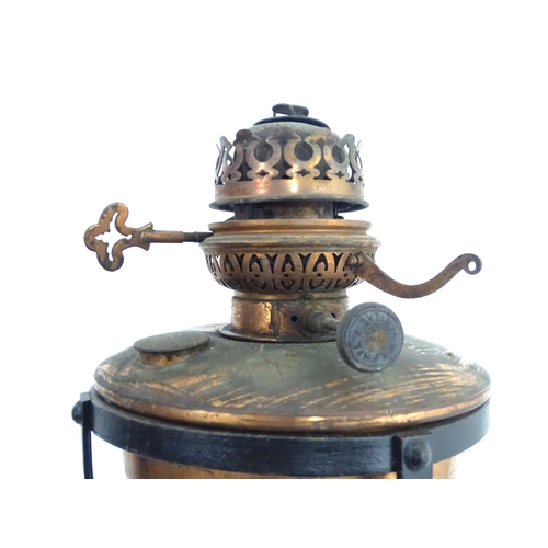 1517 - A Victorian wrought iron and copper telescopic standard lamp with burner marked ' Lampe veritas ' Ap... 