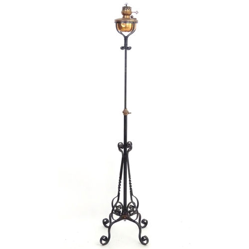 1517 - A Victorian wrought iron and copper telescopic standard lamp with burner marked ' Lampe veritas ' Ap... 