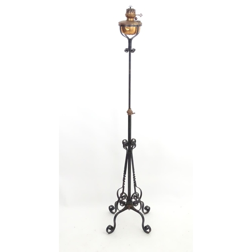 1517 - A Victorian wrought iron and copper telescopic standard lamp with burner marked ' Lampe veritas ' Ap... 