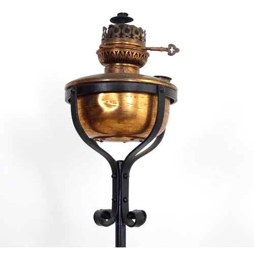 1517 - A Victorian wrought iron and copper telescopic standard lamp with burner marked ' Lampe veritas ' Ap... 