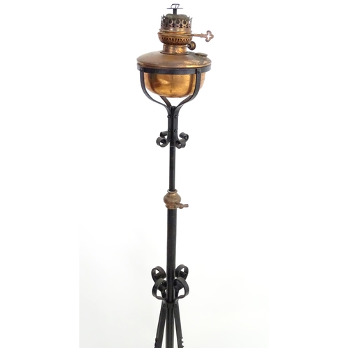 1517 - A Victorian wrought iron and copper telescopic standard lamp with burner marked ' Lampe veritas ' Ap... 