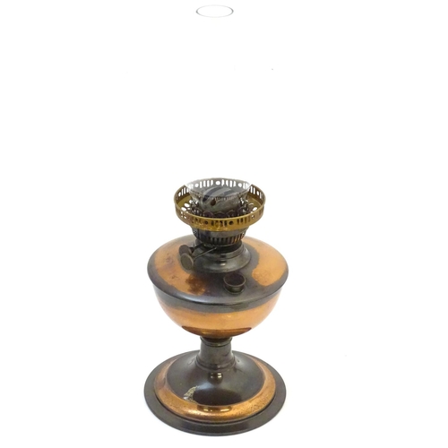 1522 - A late 19thC / early 20thC oil lamp with  glass chimney. Approx 19 1/2