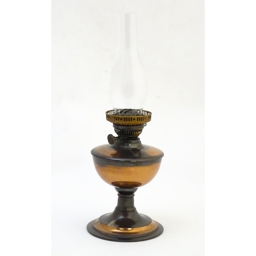 1522 - A late 19thC / early 20thC oil lamp with  glass chimney. Approx 19 1/2