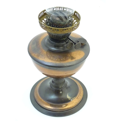 1522 - A late 19thC / early 20thC oil lamp with  glass chimney. Approx 19 1/2