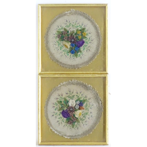 1760 - A pair of Victorian embroidered roundels with central floral relief composition, hand painted silk f... 