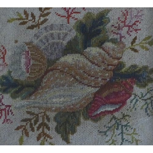 1762 - A 19thC embroidery / needlework with a still life study of shells, flowers and foliage. In a maple f... 