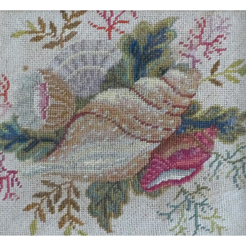 1762 - A 19thC embroidery / needlework with a still life study of shells, flowers and foliage. In a maple f... 