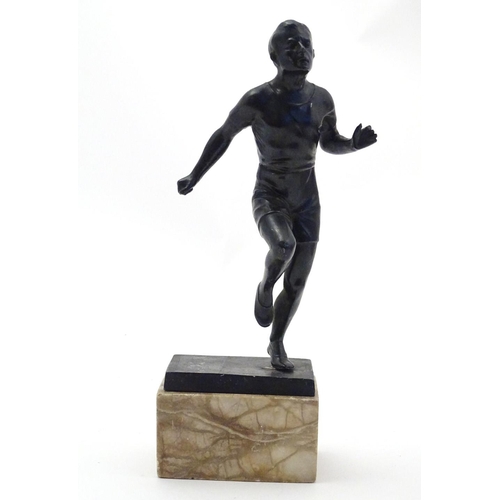 845 - A 20thC cast model of a man running on a marble base. Approx. 10 3/4