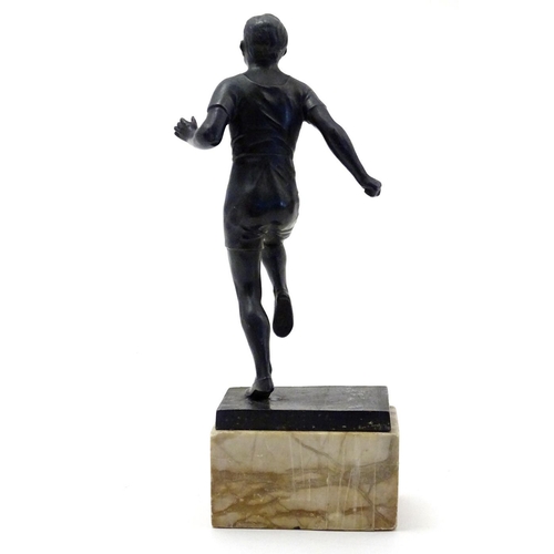 845 - A 20thC cast model of a man running on a marble base. Approx. 10 3/4