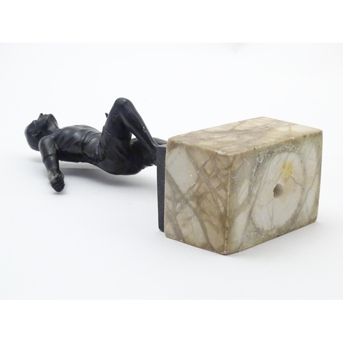 845 - A 20thC cast model of a man running on a marble base. Approx. 10 3/4