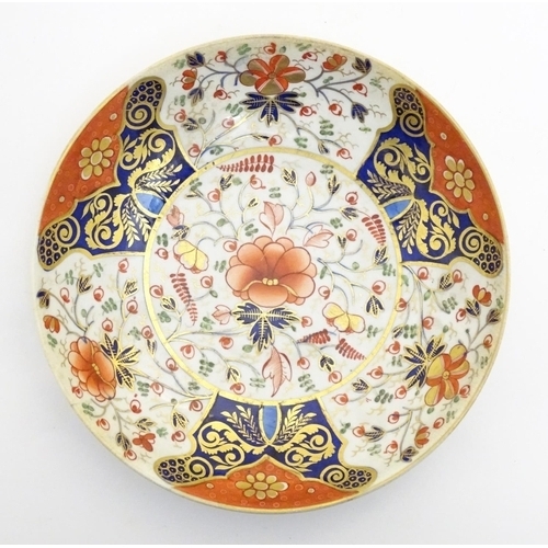 72 - A 19thC Derby dish with hand painted floral and foliate detail in the Imari palette. Marked under. A... 