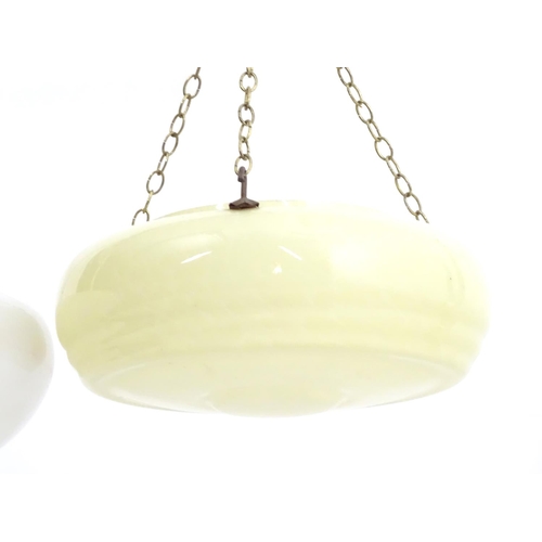 1529 - Two pedant glass shades with faux marble detail and hanging chains. The largest approx 15