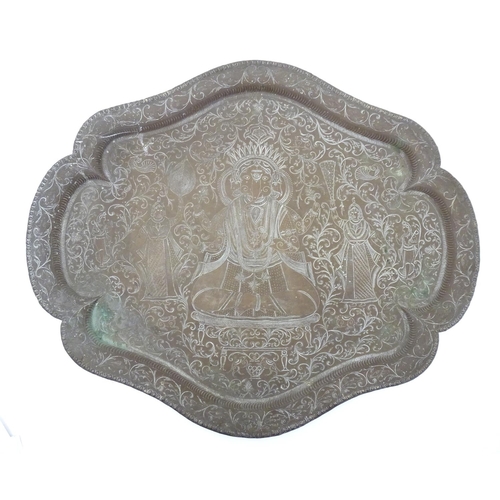 820A - A 20thC Indian brass tray with lobed rim, engraved with deity Ganesha with attendants and scrolling ... 