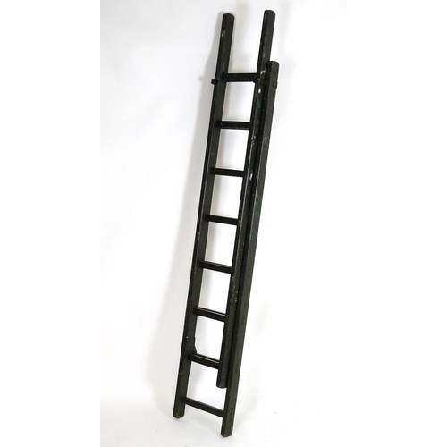 1537 - Salvage & Architectural Antiques: a green painted extending ladder, bearing label for Drew Clark & C... 