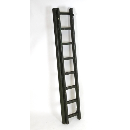 1537 - Salvage & Architectural Antiques: a green painted extending ladder, bearing label for Drew Clark & C... 