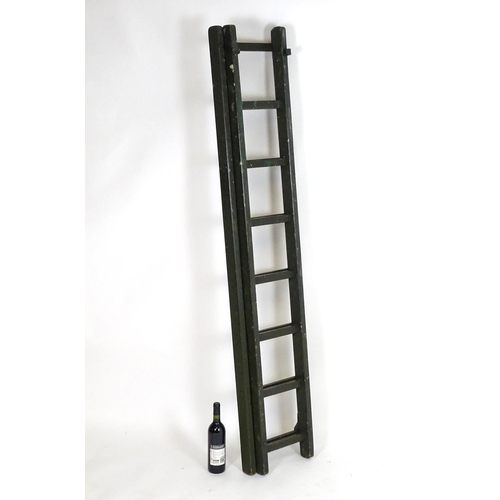 1537 - Salvage & Architectural Antiques: a green painted extending ladder, bearing label for Drew Clark & C... 