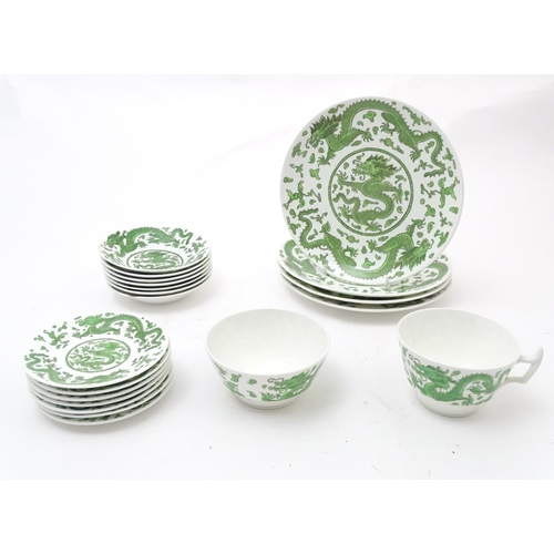 169 - A quantity of tea and dinner wares by Coalport in the pattern Green Dragon, to include plates, sauce... 