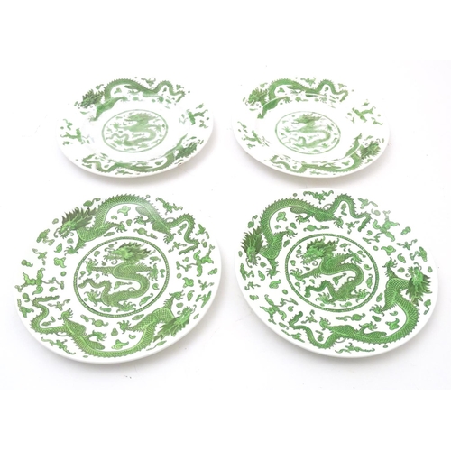 169 - A quantity of tea and dinner wares by Coalport in the pattern Green Dragon, to include plates, sauce... 