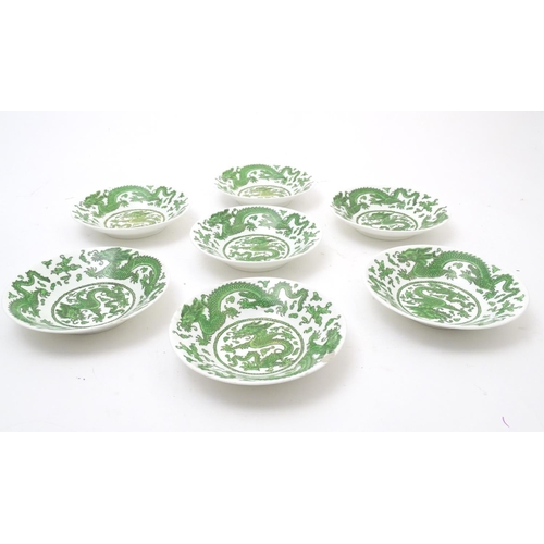 169 - A quantity of tea and dinner wares by Coalport in the pattern Green Dragon, to include plates, sauce... 