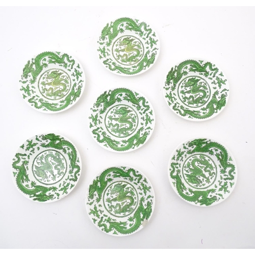 169 - A quantity of tea and dinner wares by Coalport in the pattern Green Dragon, to include plates, sauce... 